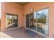 Covered patio with sliding glass doors leading to backyard at 40901 N Courage Trl, Anthem, AZ 85086