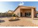 Backyard with fire pit and paved patio area at 40901 N Courage Trl, Anthem, AZ 85086