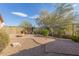 Spacious backyard with fire pit and gravel landscaping at 40901 N Courage Trl, Anthem, AZ 85086