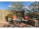 Relaxing backyard with seating area and desert landscaping at 40901 N Courage Trl, Anthem, AZ 85086