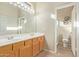 Bathroom with double vanity and a walk-in shower at 40901 N Courage Trl, Anthem, AZ 85086