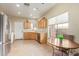 Kitchen with light wood cabinets, granite countertops, and stainless steel appliances at 40901 N Courage Trl, Anthem, AZ 85086