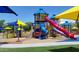 Colorful playground with multiple slides and climbing structures at 40901 N Courage Trl, Anthem, AZ 85086