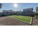 Artificial turf backyard with sitting area and string lights at 416 N 110Th Ave, Avondale, AZ 85323