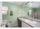 Bathroom with light green walls and a single sink vanity at 416 N 110Th Ave, Avondale, AZ 85323