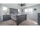 Bedroom with dark gray wooden bed frame and nightstand at 416 N 110Th Ave, Avondale, AZ 85323