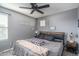 Cozy bedroom with a large bed and ceiling fan at 416 N 110Th Ave, Avondale, AZ 85323