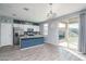 Modern kitchen with blue cabinets, granite counters, and island at 416 N 110Th Ave, Avondale, AZ 85323