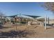 Community playground with swings and shade structures at 416 N 110Th Ave, Avondale, AZ 85323