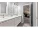 Double vanity bathroom with white cabinets and quartz countertops at 4229 N 32Nd Ave, Phoenix, AZ 85017