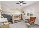 Bedroom with mountain mural, crib, and rocking chair at 4229 N 32Nd Ave, Phoenix, AZ 85017