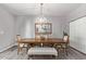 Elegant dining room with a wooden table, chandelier, and bench seating at 4229 N 32Nd Ave, Phoenix, AZ 85017