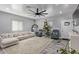 Bright and airy living room with a comfy sectional sofa and a Christmas tree at 4229 N 32Nd Ave, Phoenix, AZ 85017