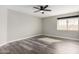 Spacious bedroom with wood-look floors and ceiling fan at 4250 E Towne Ln, Gilbert, AZ 85234