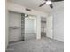 Bedroom with mirrored closet doors and gray carpeting at 4250 E Towne Ln, Gilbert, AZ 85234