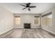 Bright living room features a fireplace and wood-look floors at 4250 E Towne Ln, Gilbert, AZ 85234