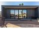 Modern backyard structure with large glass doors opening to the pool area at 4348 E Sheena Dr, Phoenix, AZ 85032