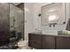 Modern bathroom with dark tile shower and floating vanity at 4348 E Sheena Dr, Phoenix, AZ 85032