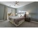 Bedroom with a large window, a ceiling fan and neutral colored walls and bedding at 4354 N 27Th Pl, Phoenix, AZ 85016