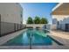 Inviting community pool surrounded by modern architecture and lush landscaping at 4354 N 27Th Pl, Phoenix, AZ 85016