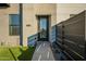 Exterior view of front door with landscaping, grass, and modern fencing at 4354 N 27Th Pl, Phoenix, AZ 85016