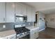 Kitchen with stainless oven, microwave, gray backsplash, and modern cabinets and countertops at 4354 N 27Th Pl, Phoenix, AZ 85016