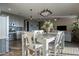 Modern kitchen and dining area featuring hardwood floors and stainless steel appliances at 4354 N 27Th Pl, Phoenix, AZ 85016