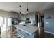 Modern kitchen featuring hardwood floors, stainless steel appliances and a center island with seating at 4354 N 27Th Pl, Phoenix, AZ 85016