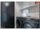 Laundry room showcasing a modern washer and dryer at 4354 N 27Th Pl, Phoenix, AZ 85016