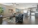 Spacious living room featuring hardwood floors, comfortable seating and a modern kitchen in background at 4354 N 27Th Pl, Phoenix, AZ 85016