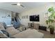 Open living room featuring stairs, hardwood floors, a ceiling fan and comfortable seating at 4354 N 27Th Pl, Phoenix, AZ 85016