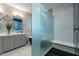 This bathroom features a double sink vanity and glass shower with black and white patterned tile at 4354 N 27Th Pl, Phoenix, AZ 85016