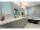 This main bathroom features double sinks, white countertops, and a black soaking tub at 4354 N 27Th Pl, Phoenix, AZ 85016