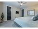 This main bedroom boasts carpet flooring, a ceiling fan, stylish decor, and black interior doors at 4354 N 27Th Pl, Phoenix, AZ 85016