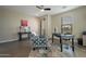 Comfortable home office featuring natural light, hardwood floors and a stylish accent chair at 4354 N 27Th Pl, Phoenix, AZ 85016