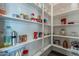 Well-organized pantry with multiple shelves, stocked with various food products and household supplies at 4354 N 27Th Pl, Phoenix, AZ 85016