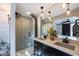 Modern bathroom with herringbone tile shower and double vanity at 45 E Woodward Dr, Phoenix, AZ 85004