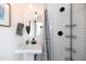 Clean bathroom with white tile and polka dot shower curtain at 45 E Woodward Dr, Phoenix, AZ 85004