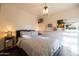 Bright bedroom with a double bed and patterned bedding at 45 E Woodward Dr, Phoenix, AZ 85004