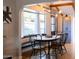 Bright dining room with bay window and farmhouse table at 45 E Woodward Dr, Phoenix, AZ 85004