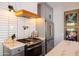 Modern kitchen with stainless steel appliances and marble countertops at 45 E Woodward Dr, Phoenix, AZ 85004