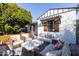 Inviting patio with wicker furniture and a coffee table at 45 E Woodward Dr, Phoenix, AZ 85004