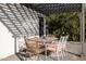 Relaxing patio with pergola, table, and chairs at 45 E Woodward Dr, Phoenix, AZ 85004