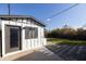 Detached studio with white siding and dark trim at 45 E Woodward Dr, Phoenix, AZ 85004