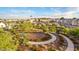 Aerial view of community park with walking paths and lush landscaping at 4931 E Village Dr, Scottsdale, AZ 85254