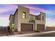 Two-story modern home with attached garage and desert landscaping at 4931 E Village Dr, Scottsdale, AZ 85254