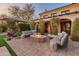 Outdoor patio with fire pit, seating area, and beautiful landscaping at 4949 E Lincoln Dr # 34, Paradise Valley, AZ 85253