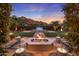 Peaceful backyard oasis with fire pit, spa, and mountain views at 4949 E Lincoln Dr # 34, Paradise Valley, AZ 85253