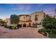 Mediterranean style home with a large driveway and landscaping at 4949 E Lincoln Dr # 34, Paradise Valley, AZ 85253