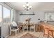 Charming dining area with a rustic table, chairs, and decorative accents at 5496 S 237Th Ln, Buckeye, AZ 85326